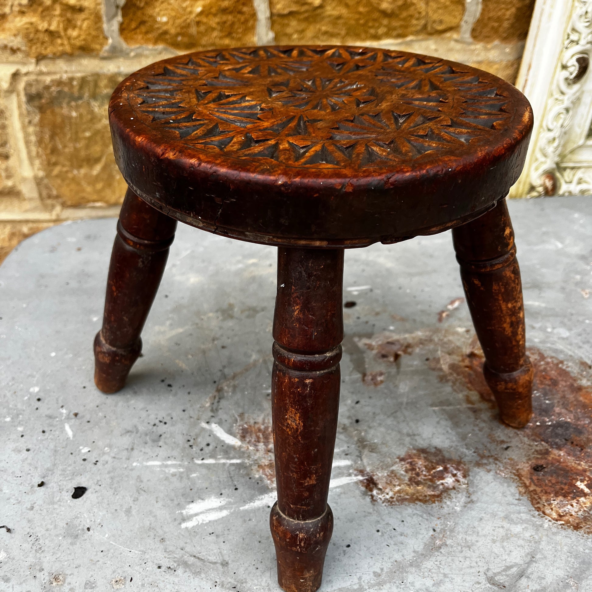 Vintage wooden stool with intricate carvings