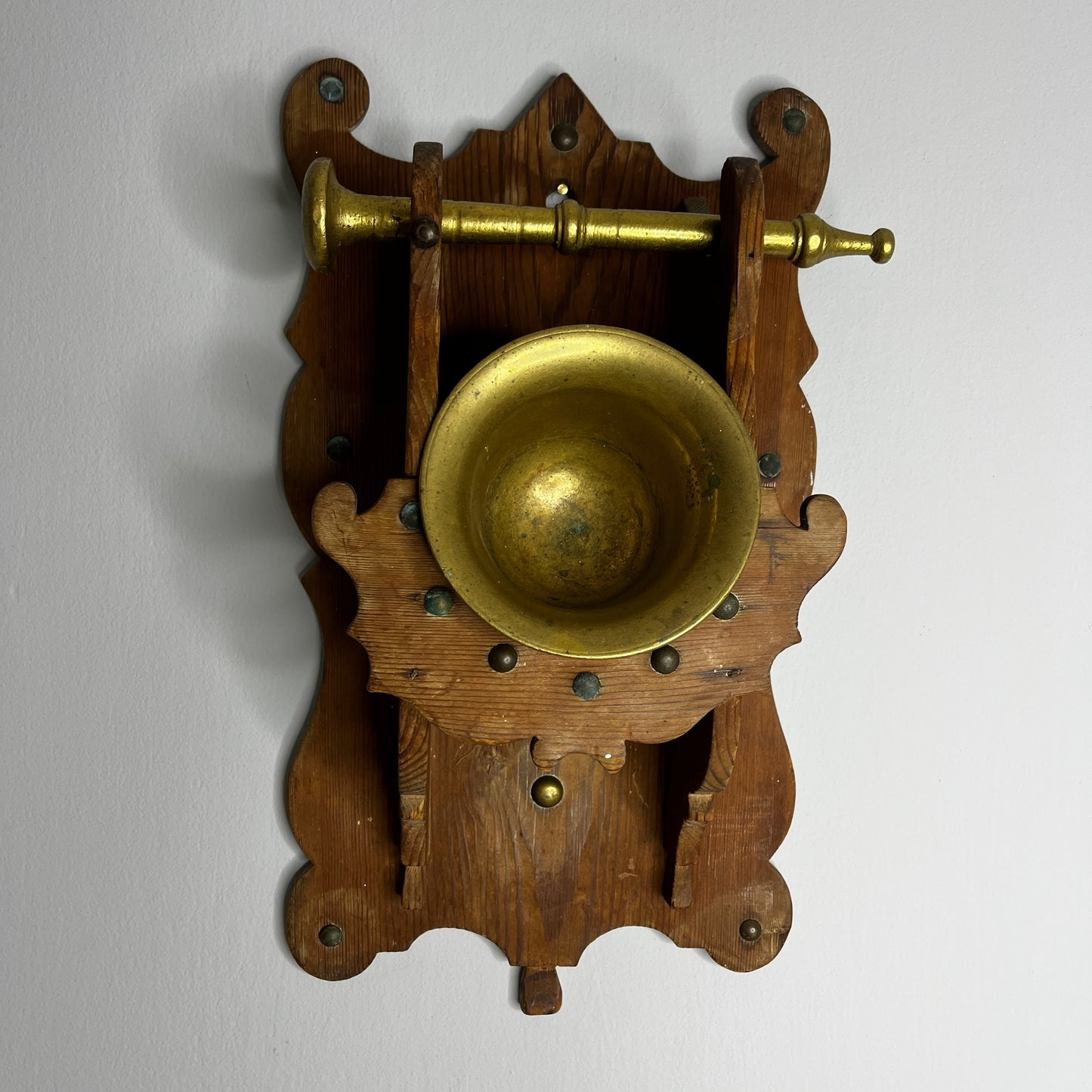 Antique Brass Mortar and Pestle on a Carved Wooden Wall Bracket