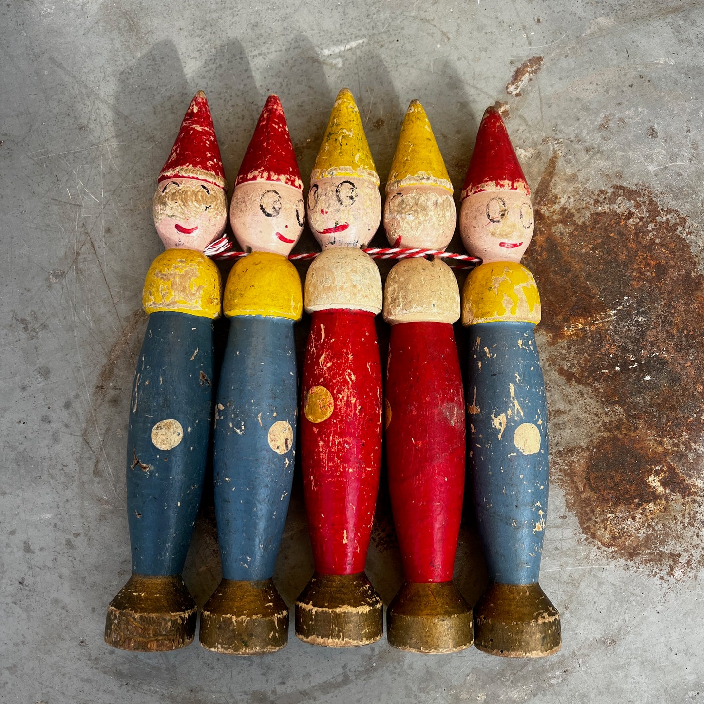 Hand-painted wooden skittles with colorful traditional detailing.
