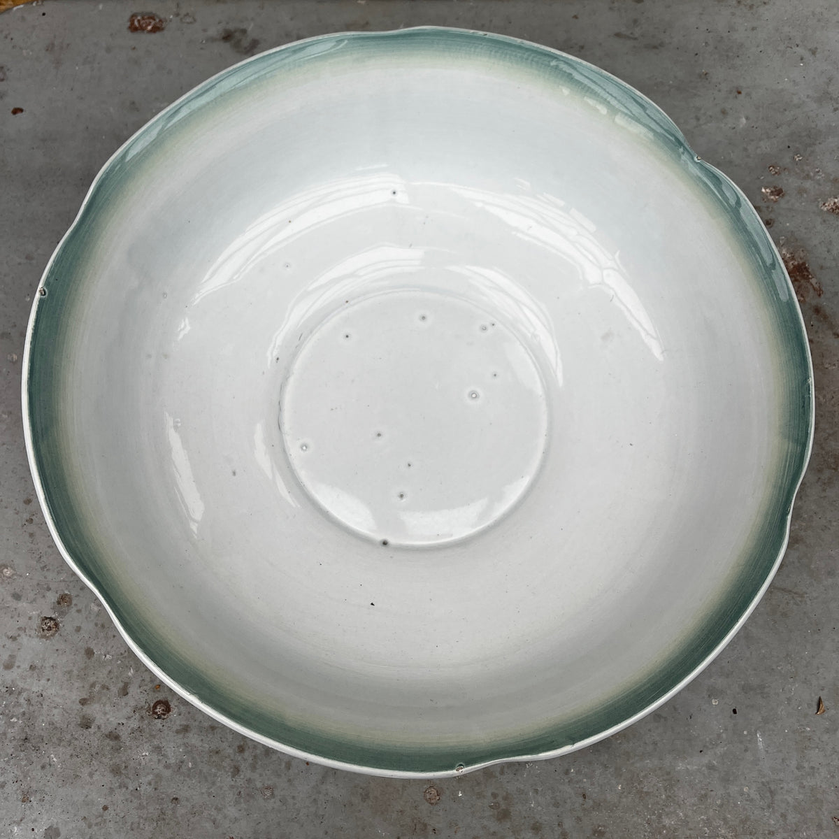 Mid-20th-century Sarreguemines ceramic salad bowl in the Oeillet pattern, featuring a delicate floral design.