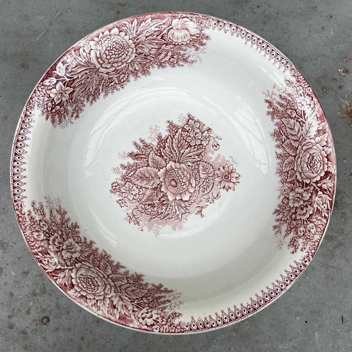 19th-century French ironstone washbasin with a traditional transfer-printed decorative pattern.