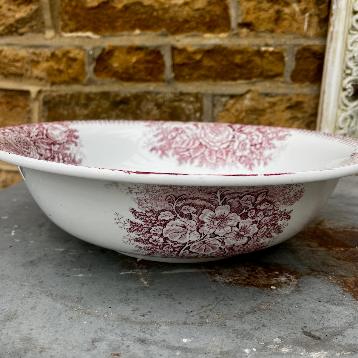 19th-century French ironstone washbasin with a traditional transfer-printed decorative pattern.