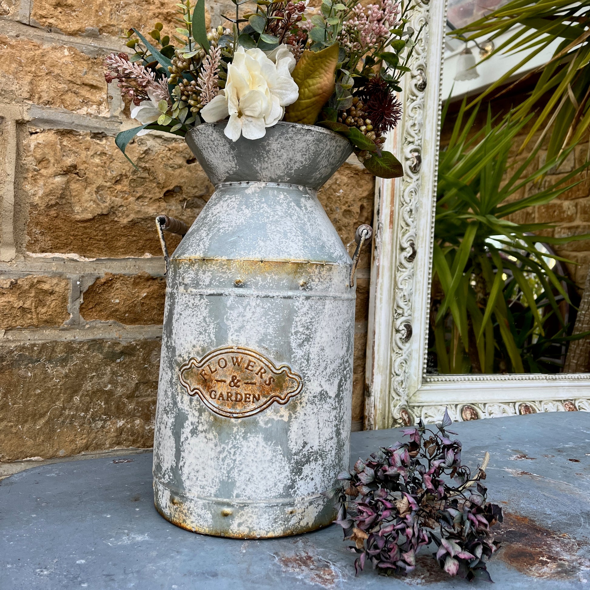 A large vase in the shape of a milk churn, ideal for flowers or dried flowers