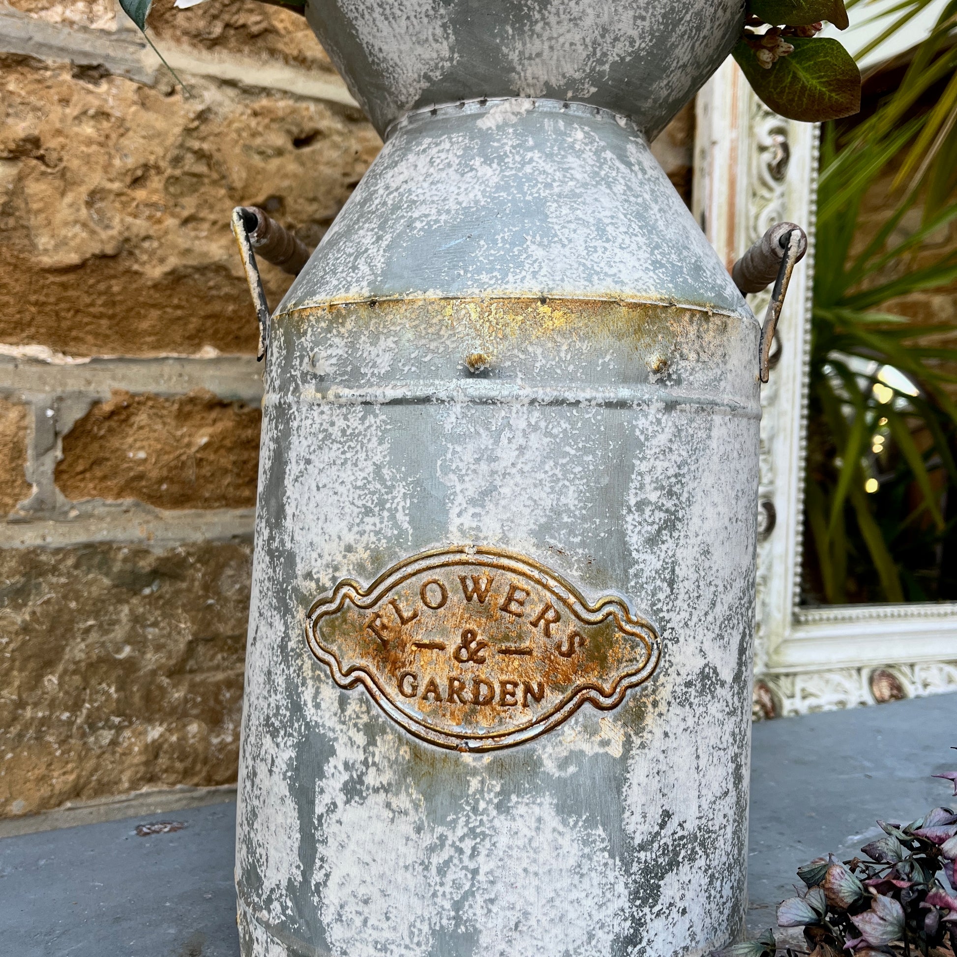 A large vase in the shape of a milk churn, ideal for flowers or dried flowers