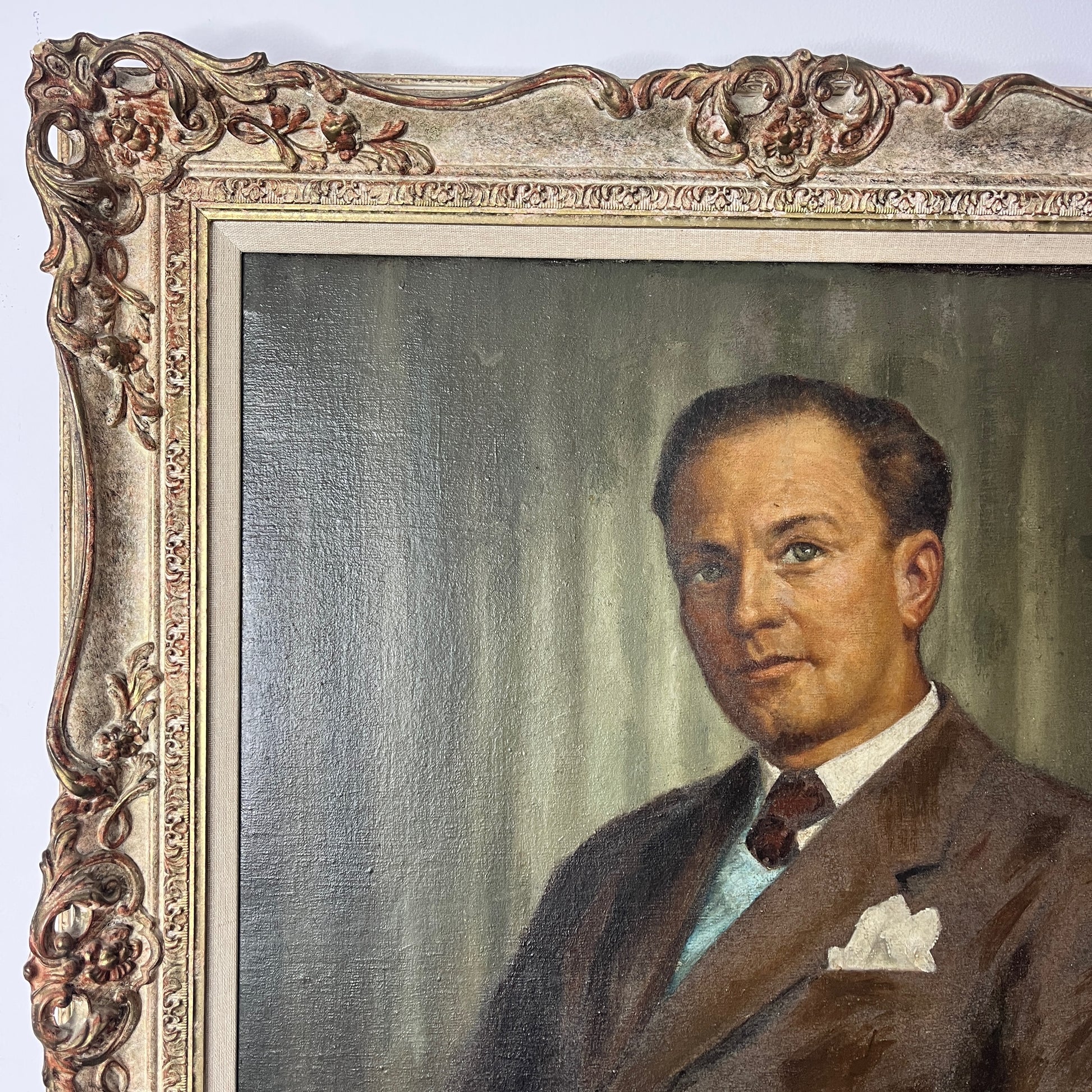 Framed oil on board portrait of a gentleman, signed by the artist. The painting depicts the subject in traditional attire with detailed facial features and a muted background, presented in a classic frame.